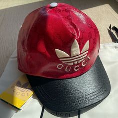 Brand New Gucci X Adidas Collaboration Red And Black Coated Canvas All Over Gg Monogram Baseball Cap. Designer Gucci Baseball Cap With Embroidered Logo, Luxury Gucci Baseball Cap, Gucci Casual Baseball Cap With Curved Brim, Casual Gucci Baseball Cap With Curved Brim, Designer Snapback Baseball Cap With Embroidered Logo, Luxury Visor Baseball Cap For Streetwear, Luxury Baseball Cap For Streetwear With Visor, Luxury Streetwear Baseball Cap, Luxury Baseball Cap With Logo And Curved Brim