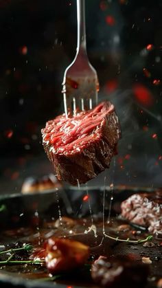 a steak being cooked on a grill with a fork sticking out of it's side