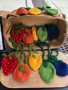 crocheted fruits and vegetables are displayed on a table