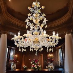 a chandelier hanging from the ceiling in a room