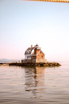 a house on an island in the middle of water