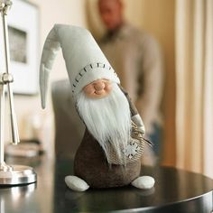 a gnome figurine sitting on top of a table