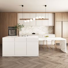 a modern kitchen with marble counter tops and white cabinets, along with wooden flooring