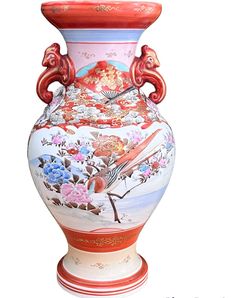 an ornate vase with birds and flowers painted on the outside, sitting in front of a white background