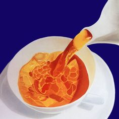 an orange sauce in a white bowl on a blue background with a spoon next to it