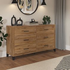 a wooden dresser sitting in front of a mirror on top of a hard wood floor