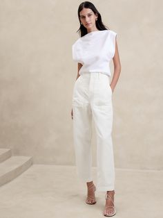 A fresh take on the classic utility pant, this vintage-inspired pair pairs back the utilitarian styling—the better to show off this beautiful fabric woven from organic cotton and luxurious linen.  High rise (11").  Relaxed fit though the thigh, tapered leg.  Ankle length.  Zip fly with book-and-bar closure.  Front and back pockets.  Unlined.  High rise (11").  Relaxed fit though the thigh, tapered leg.  Ankle length.  Ankle length.  Inseams: Short 24. 5", Regular 26. 5", Long 29. 5" Model: Size Cargo Outfit, White Midi Skirt, Cargo Pants Outfit, Spring Blossoms, Mango Fashion, Utility Pants, Banana Republic Pants, Luxury Linen, Cargo Pant