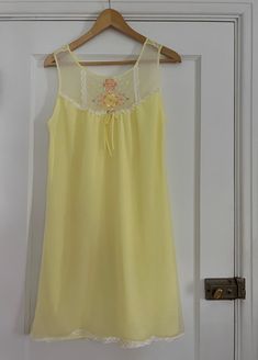 1970s yellow nightgown with floral embroidery 💐 Ruffled lace trim + bow 100% nylon Tag size L - est to fit M/L best but go by measurements below. Model is 5'2 34/27/38 for reference. Buyer is responsible for confirming fit and sales are final. If you have any questions please let me know before purchasing! CONDITION:  overall great vintage condition, a few faint pink spots on the back see pics MEASUREMENTS: (taken laying flat then doubled where applicable:) 36" long 36-38" pit to pit 38" waist Spring Yellow Nightgown For Loungewear, Yellow Summer Nightgown For Sleep, Yellow Summer Nightgown, 1970s Nightgown, Yellow Nightgown, Pastel Lingerie, Women's Nightgowns, Pajama Robe, Pastel Yellow