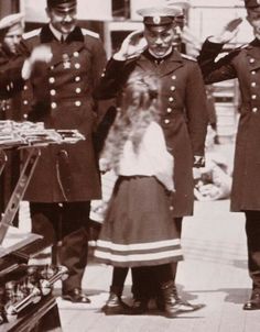 an old black and white photo of people in uniform