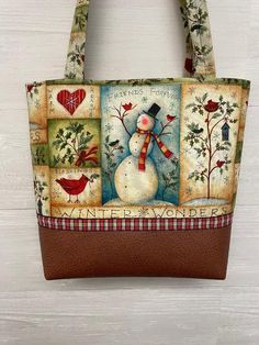 a handbag with an image of a snowman on it