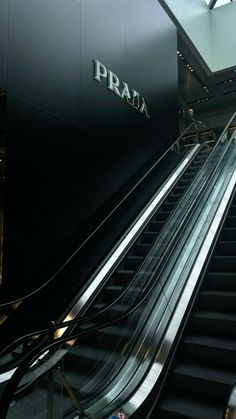 an escalator with the word prax written on it