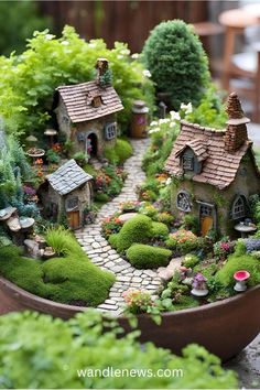 a miniature garden with small houses and trees