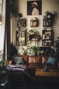 a living room filled with furniture and lots of plants