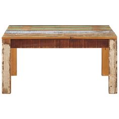 an old wooden table with colorful paint on the top and bottom half, against a white background