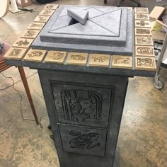 an old fashioned stove in the middle of a room