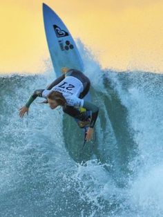 a person riding a surf board on a wave