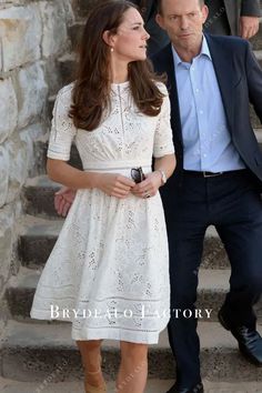 the duke and princess of cambridge are walking down some steps with their hands in each other's pockets