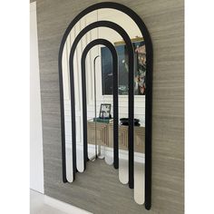 a mirror that is on the side of a wall