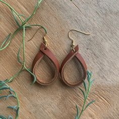 Leather Hoop Earrings – Haute JS Design Folded Leather Earrings, Leather And Wire Jewelry, Leather Earrings Diy How To Make, Leather Strip Earrings, Leather Earring Patterns Free, Crafts With Leather Scraps, Braided Leather Earrings Diy, Leather Diy Earrings, Homemade Leather Earrings