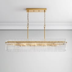 Title: Casandra Chic 8-light Crystal Glass Bars Rectangle Linear Chandelier - Brushed Brass Brushed Brass Finish. The ceiling plate is made of iron; shade: N/A. Includes two 19.7 inches chains, which can be shortened. Modern Dining Room Light Fixtures, Modern Dining Room Lighting, Dining Room Light Fixtures, Light Crystal, Glass Bar, Linear Chandelier, Lighting Store, Dining Room Lighting, Modern Dining Room