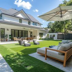 an outdoor living area with lawn and patio furniture