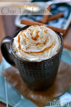 a cup filled with whipped cream and cinnamon