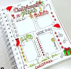 a christmas planner is open on top of a white table with red and green writing