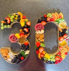 the number 50 made out of fruits and vegetables