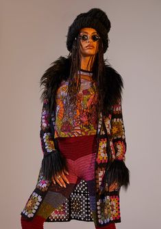 a mannequin dressed in colorful clothing and fur