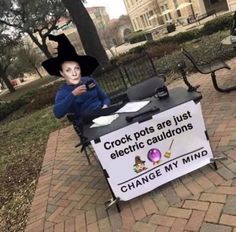 a table with a sign that says crock pots are just electric cauldons change my mind