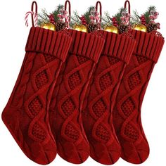 three red christmas stockings with candy canes and decorations hanging from the top, on a white background