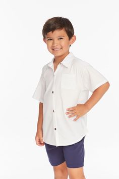 Got a little dude in your life? Take a peek at this rad shirt! Featuring a timeless button down cut and stylish collar, this white top is crafted from comfy rayon and ideal for sunny days. And don't forget - it goes great with shorts and flip flops for a laid-back vibe! Junior Girl Dresses, Boys Shirt, Scarf Sale, White Button Down, Active Wear Shorts, Dresses Kids Girl, Short Shirts, Skirted Swimwear, Short Rompers