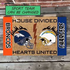 a door mat with two football helmets and the words, sports team can be changed house divided hearts united