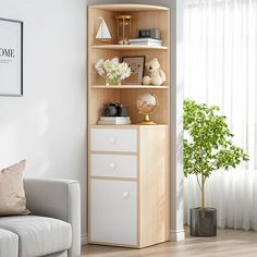 a living room with a white couch and wooden shelves