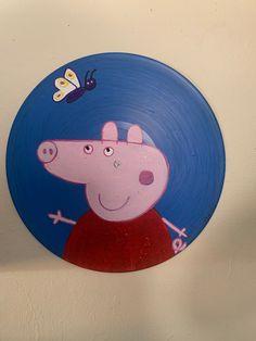 a peppa pig painted on the side of a wall