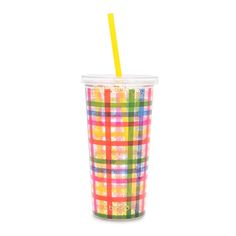 a cup with a yellow straw in it