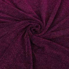 a close up shot of the fabric in dark purple color, it is very soft and shiny