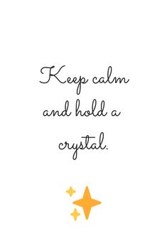 the words keep calm and hold a crystal are written in black ink on a white background