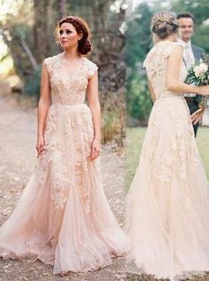 two women in wedding gowns standing next to each other and one wearing a dress with flowers