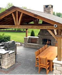 an outdoor kitchen and grill area is shown