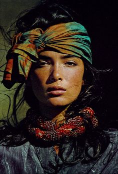 a woman with a bandana on her head