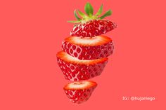 some strawberries are arranged on a pink background