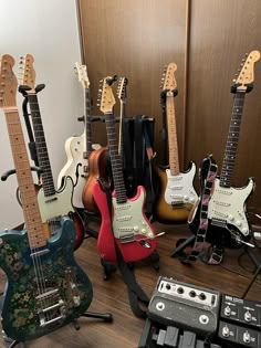 guitars and amps lined up on a table