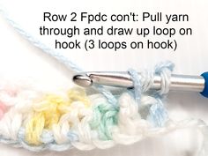 a crochet hook with the words row 2 fpdc cont pull yarn through and draw up loop on hook 3 loops