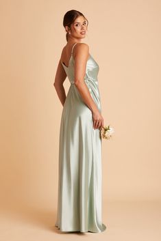 Your bridesmaids will shimmer in this satin wrap dress, with its plunging neckline and feminine side bow. This wrap dress delivers on the sexy, with its deep-V neckline and a high slit. For optimum fit, wear a backless bra and wrap the dress as tightly as possible around your bust (where your bra band sits). | Sage Bridesmaid Dress Shiny Satin Size XS | Birdy Grey Cindy Sage Green Satin Bridesmaid Dresses, Grey Jay, Sage Bridesmaid Dress, Jay Dress, Brooklyn Dress, Sage Bridesmaid Dresses, Satin Gowns, Satin Bridesmaid Dress, Grey Bridesmaids