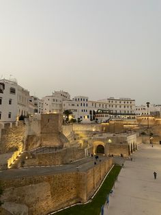 an old city is lit up at night