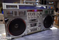 an old fashioned radio sitting on top of a table