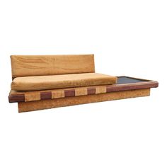 a couch made out of plywood and wood with a leather cushion on the back