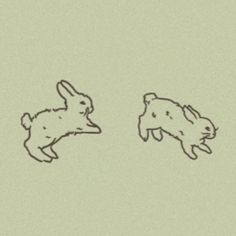 two rabbits are facing each other in opposite directions, one is jumping and the other is running