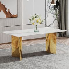 a white marble table with gold legs in a modern living room, decorated with flowers and art work